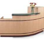 Curved Reception Shell With Tower, Contrast Finish Recess Toe Kick, #809 Hardwood Inlay, Clear Glass Transaction Counter With Luma Steel Subtop And Anodized Aluminum Standoffs. 